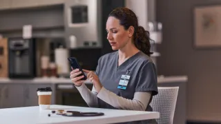 Healthcare professional looking at phone